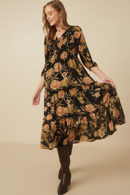 Hannah floral print smocked dress in black, featuring a V-neckline and tiered skirt.