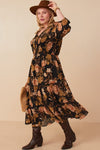  Curvy model wearing Hannah Romantic Floral Smocked Dress in Black, featuring floral print and three-quarter sleeves.