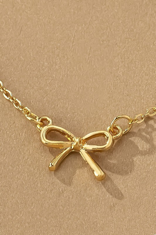 Delicate Bow Pendant Necklace in Gold