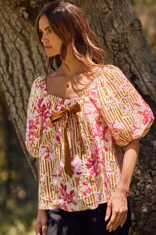 Fuchsia floral and amber striped blouse with puff sleeves and ribbon tie